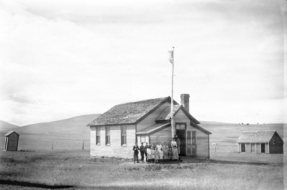 Black and white photo of a one room schoolhouse in Cascade County, Montana.